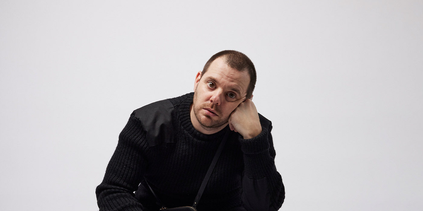 Studio Portrait of Mike Skinner of The Streets, wearing black Sweater